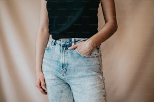 a woman wearing a black shirt and jeans