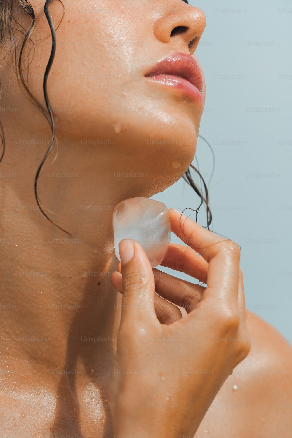 a woman holding a piece of plastic in her hand