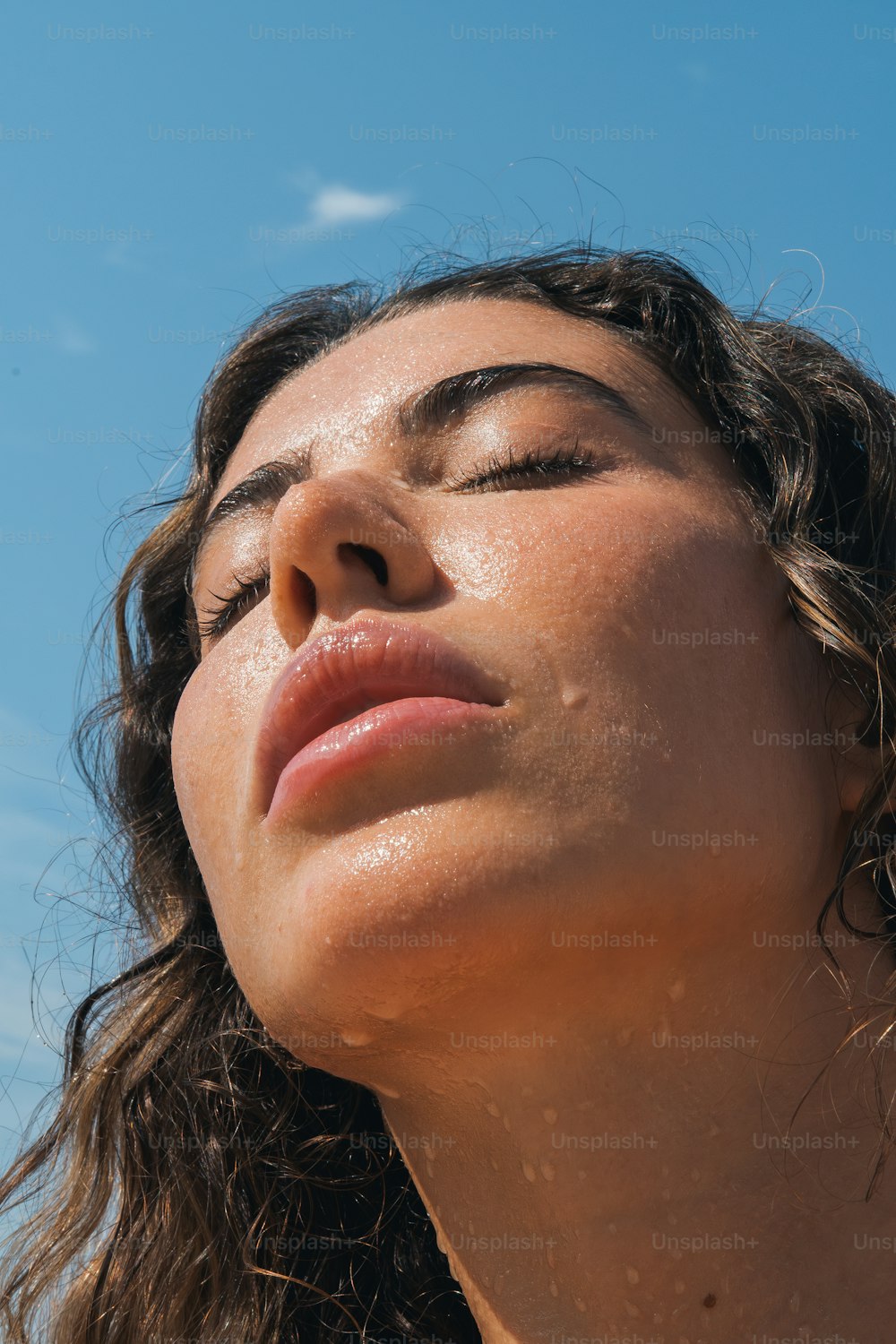 a close up of a woman with her eyes closed