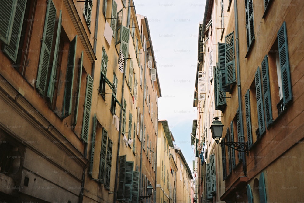 a narrow city street lined with tall buildings