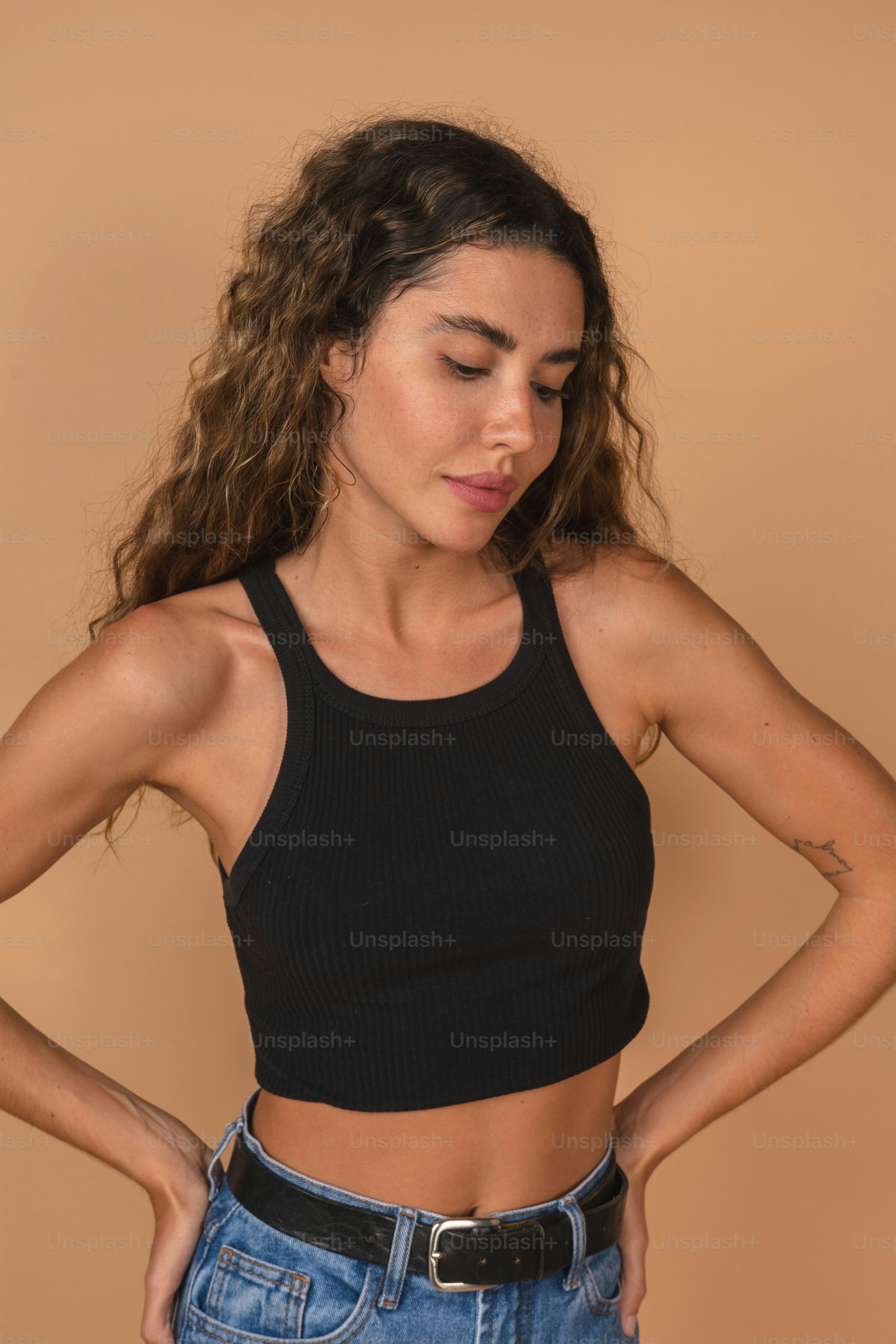 a woman with her hands on her hips