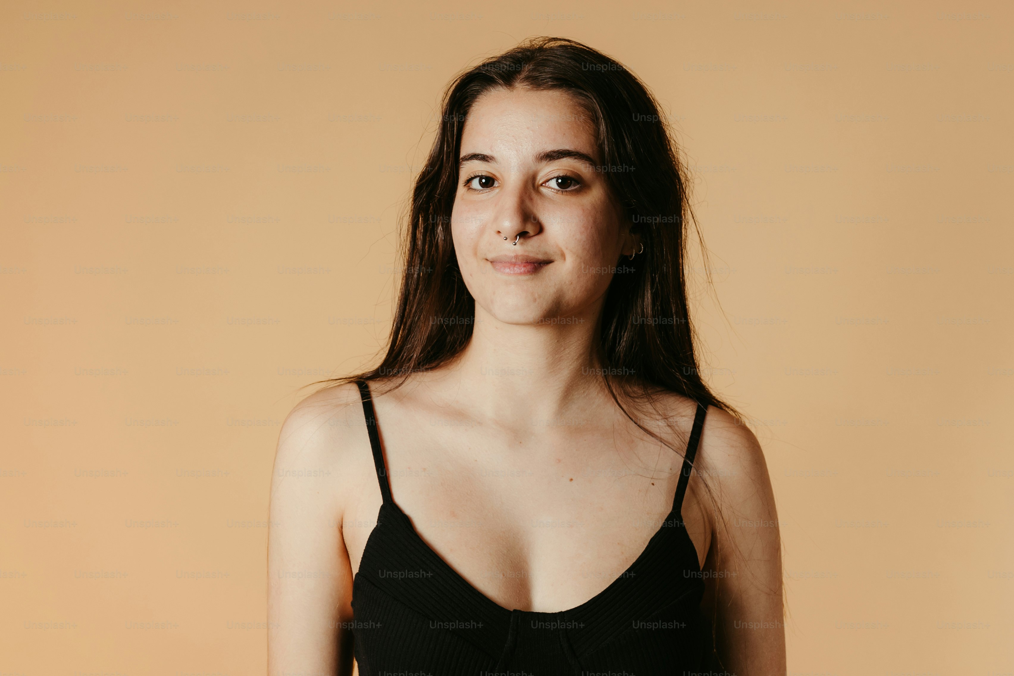 a woman in a black dress posing for a picture