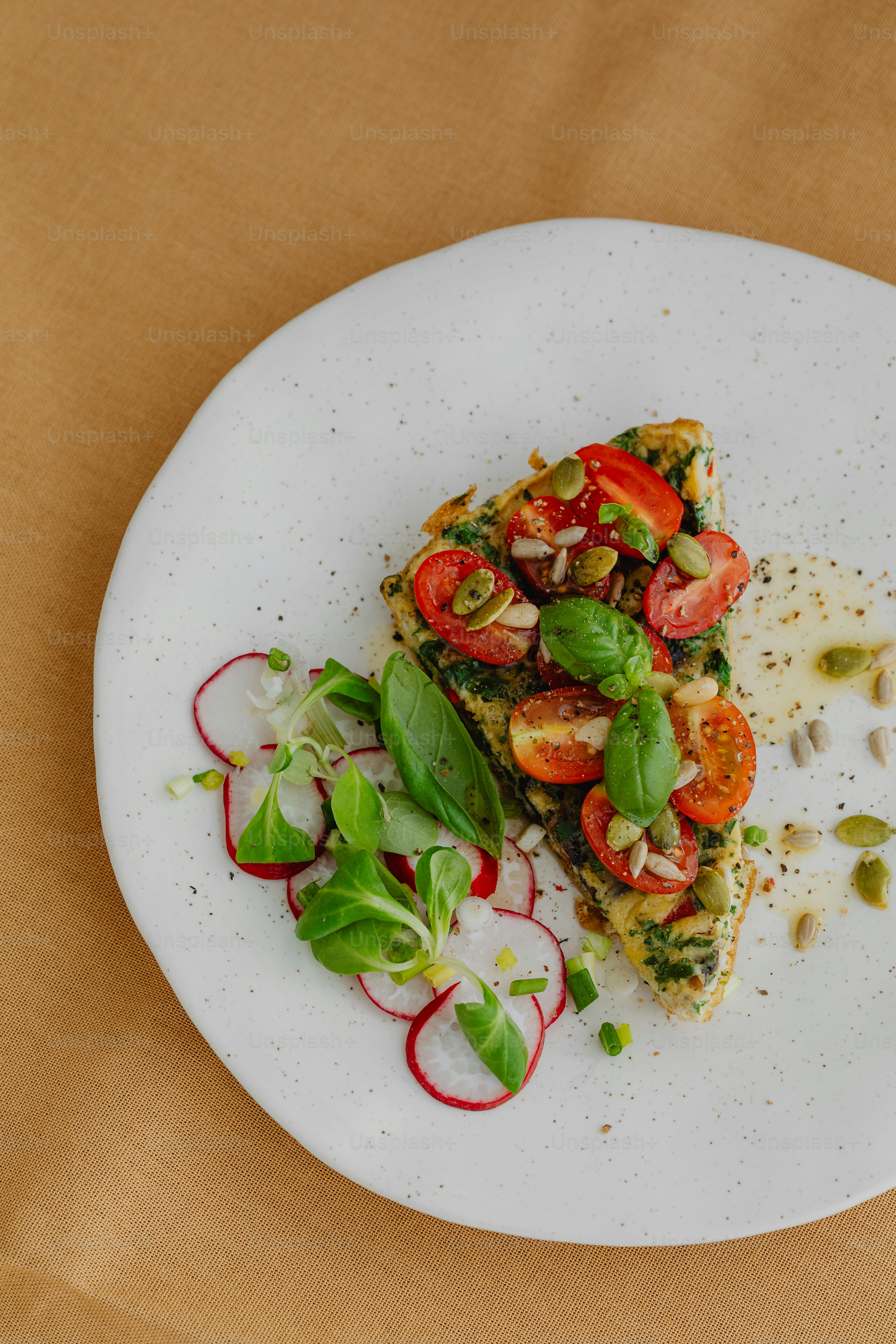 a white plate topped with a slice of pizza