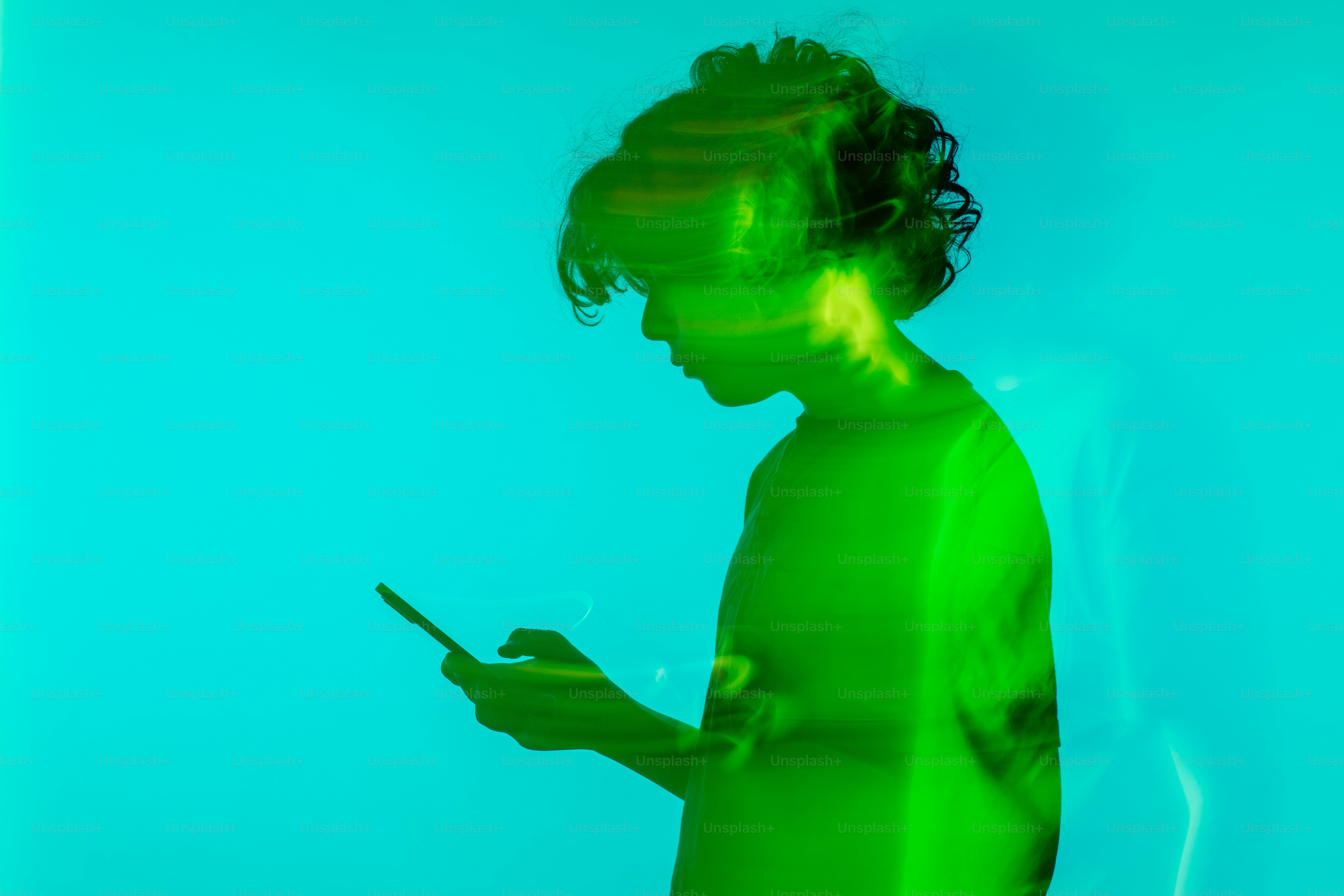 a blurry image of a person using a cell phone
