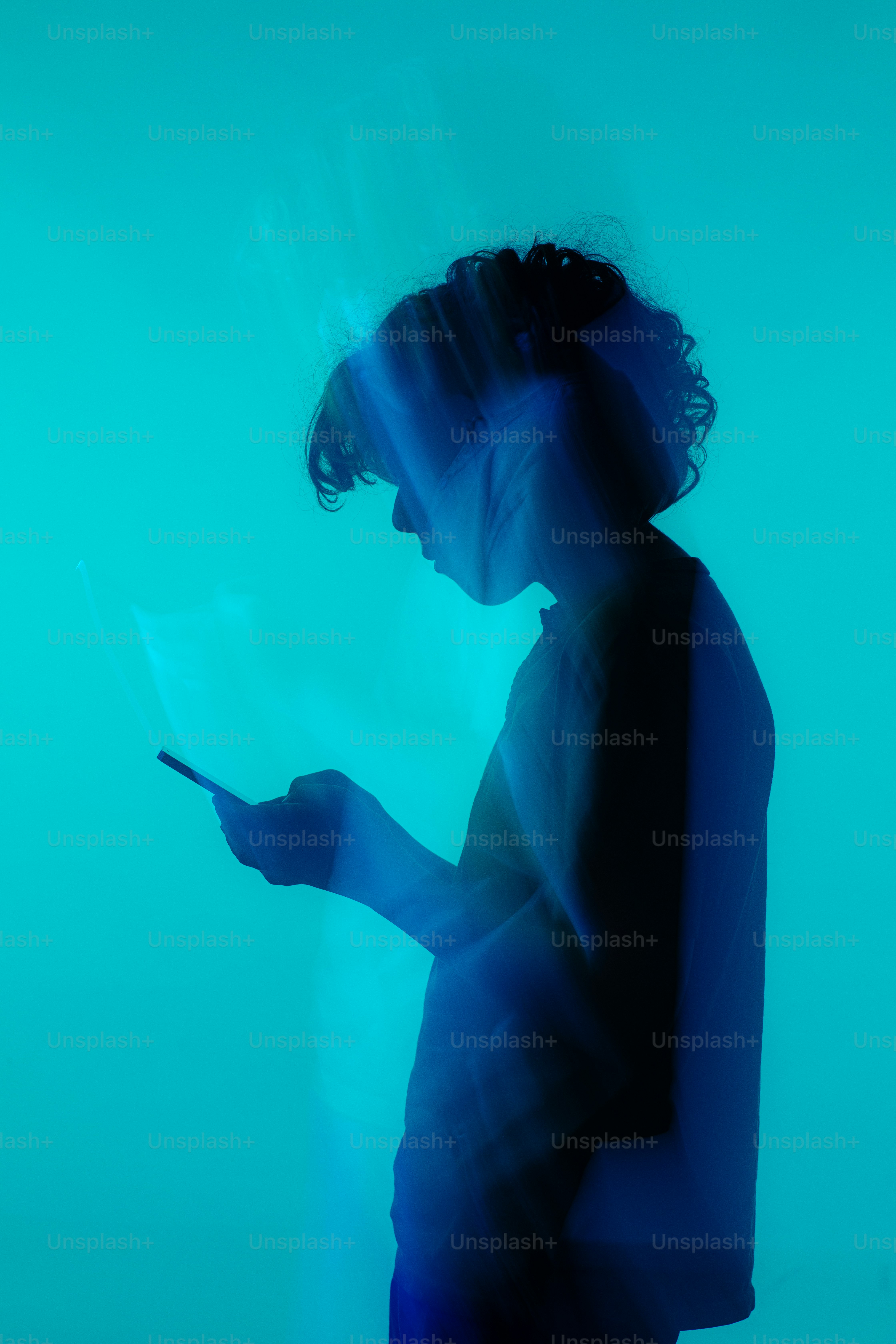 a person holding a laptop computer in their hands