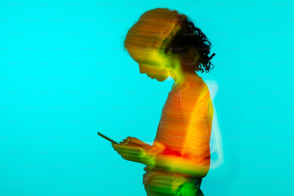 a blurry image of a person using a cell phone