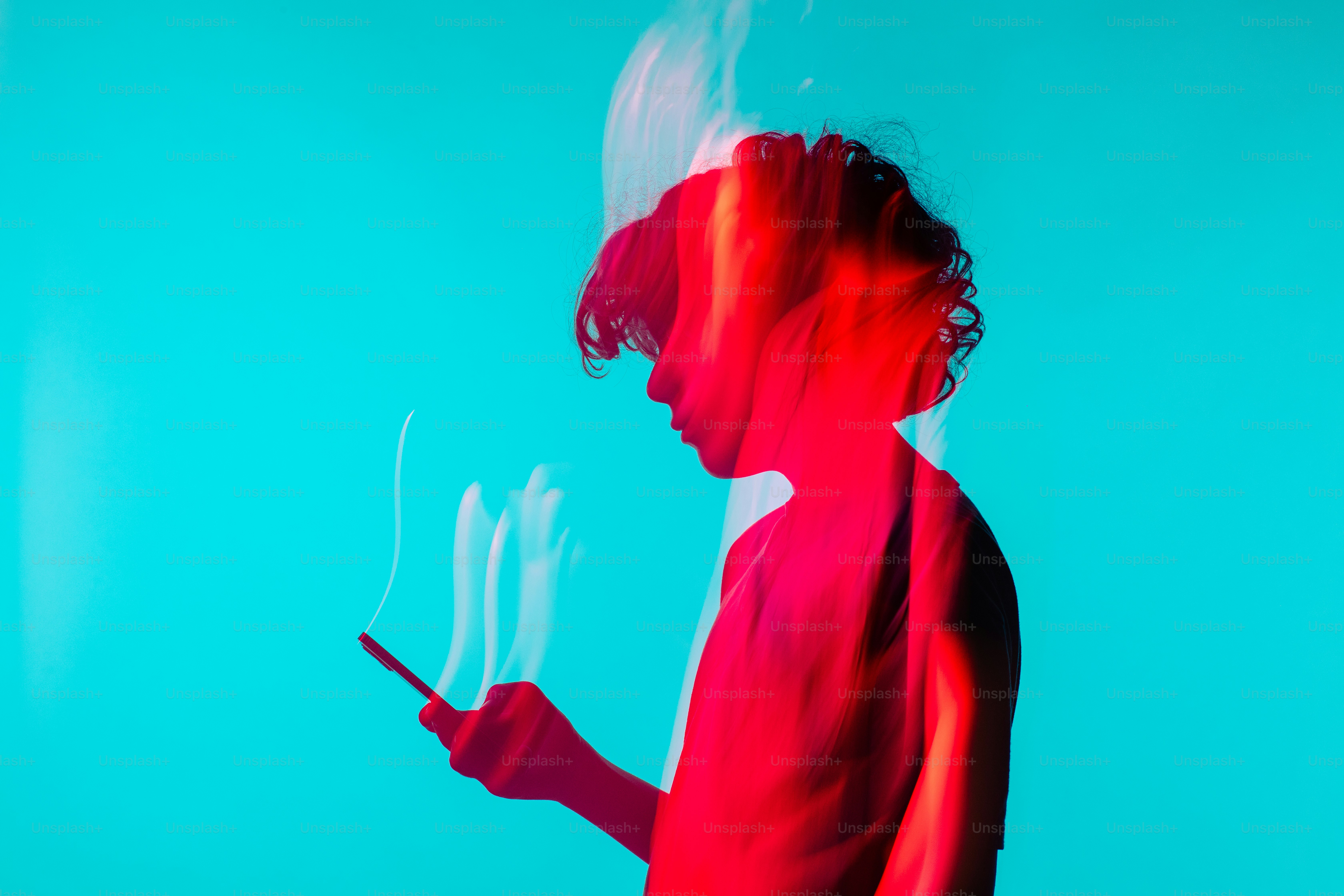 a woman in a red dress holding a cell phone