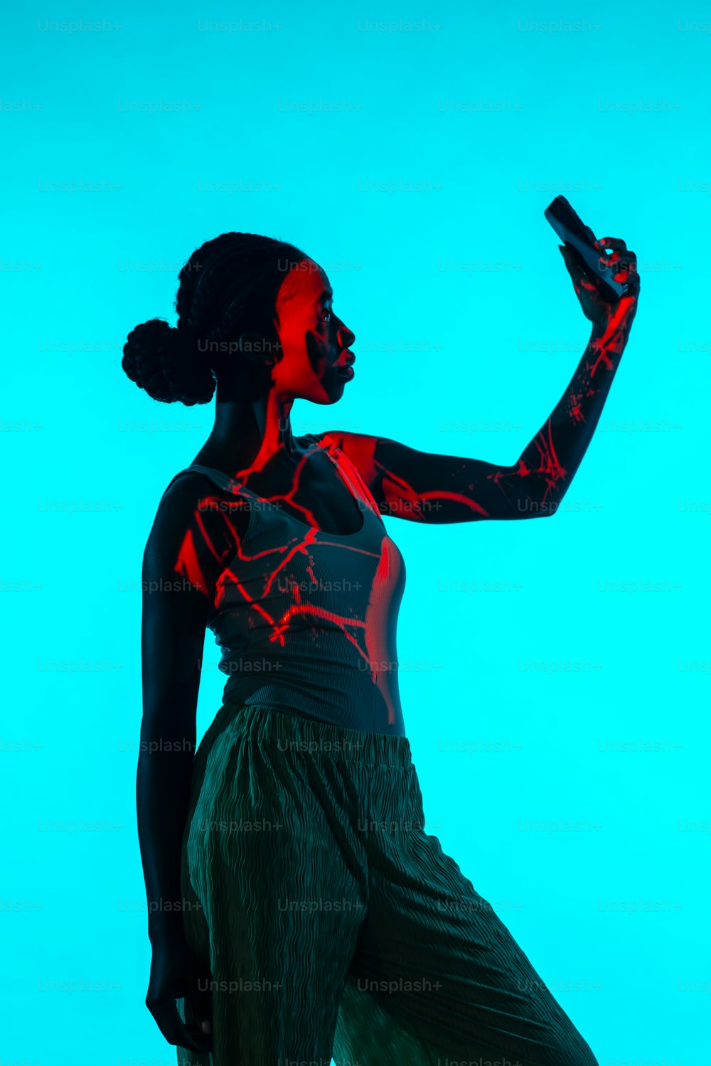 a woman with red light painted on her body