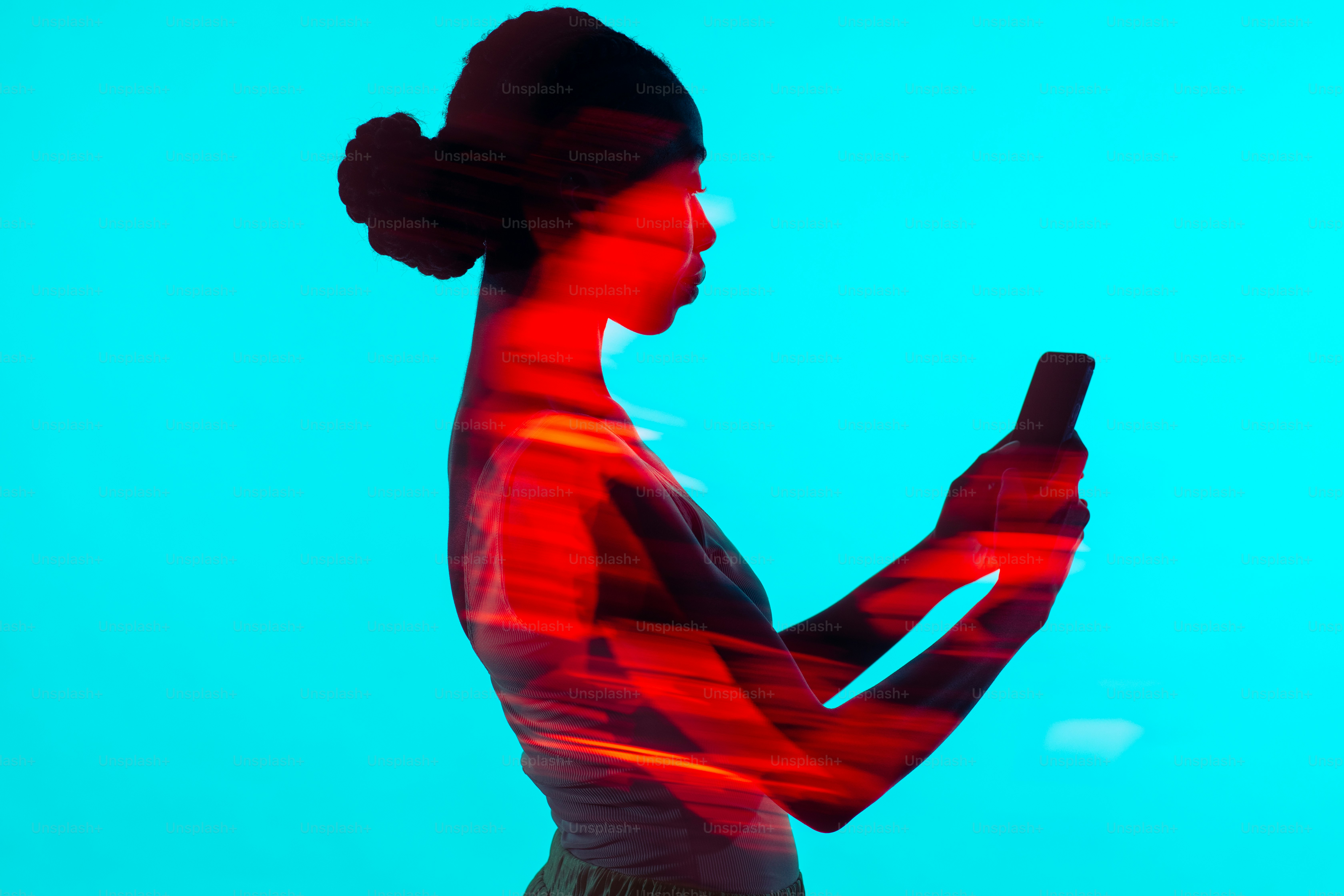 a woman holding a cell phone in her hand