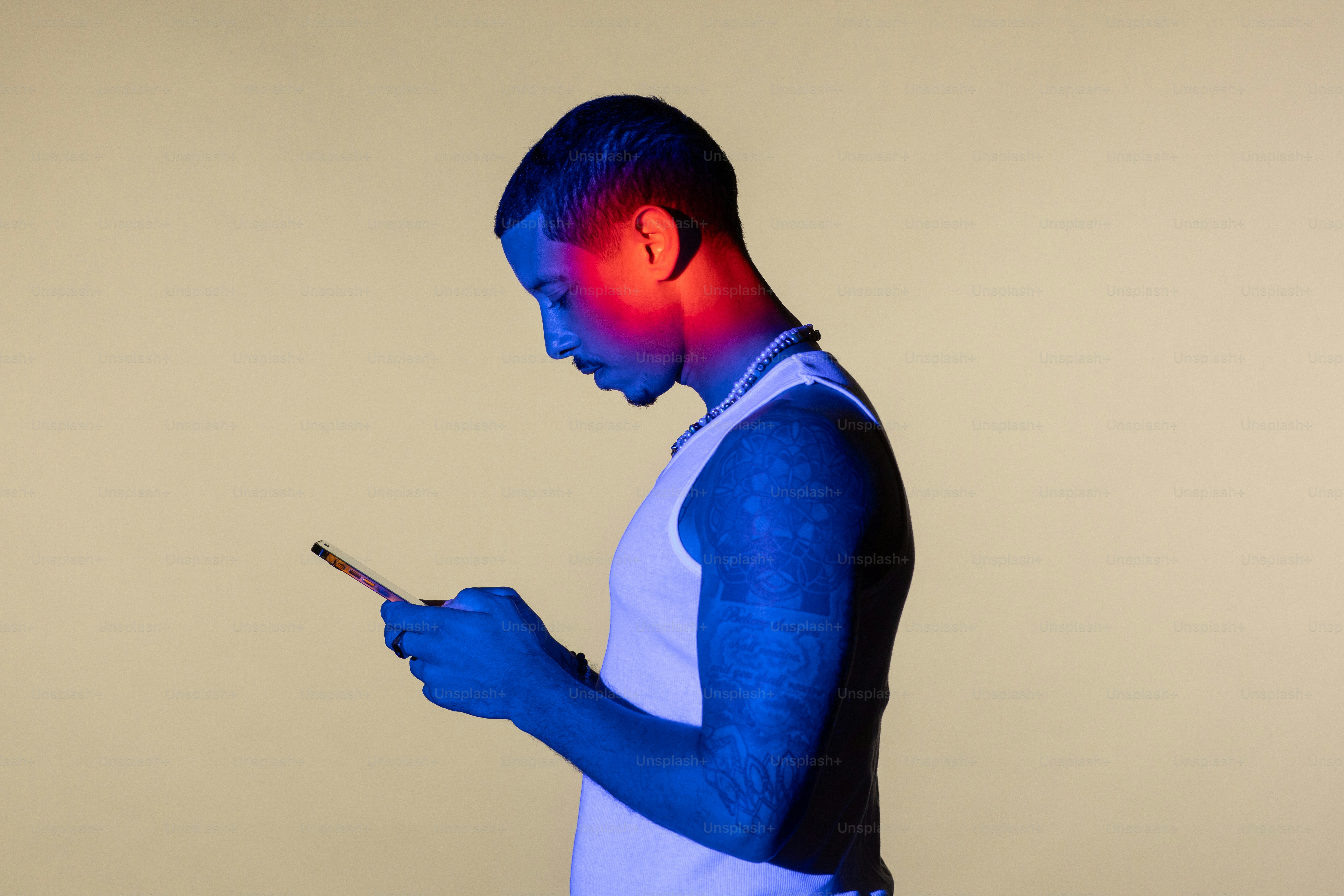 a man holding a cell phone in his hand