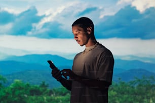 a man holding a cell phone in his hands