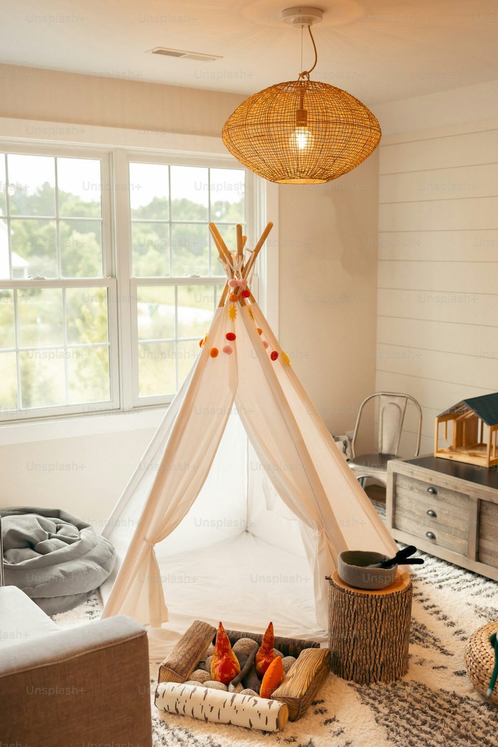 a room with a bed and a teepee