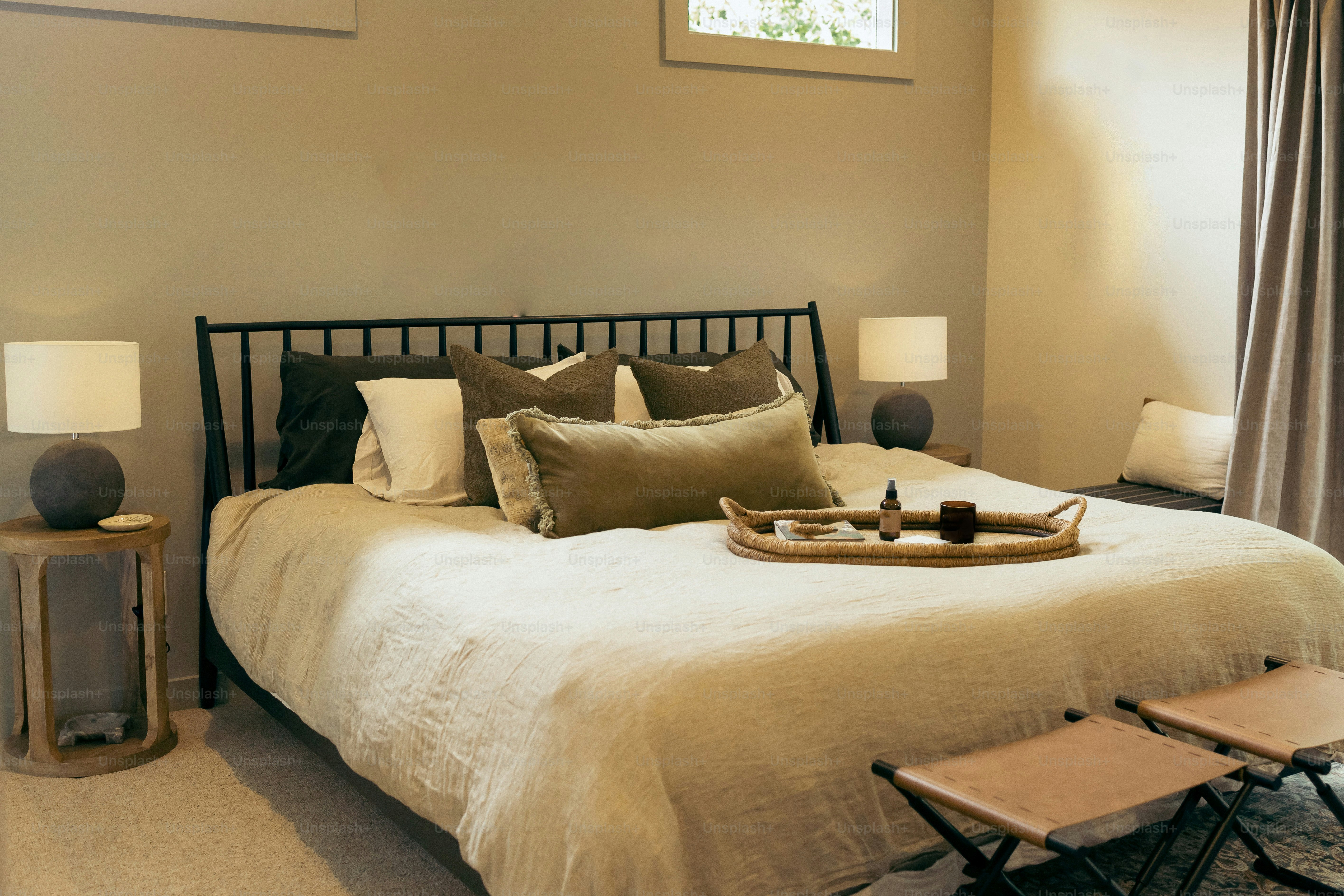 a bed with a tray of food on top of it