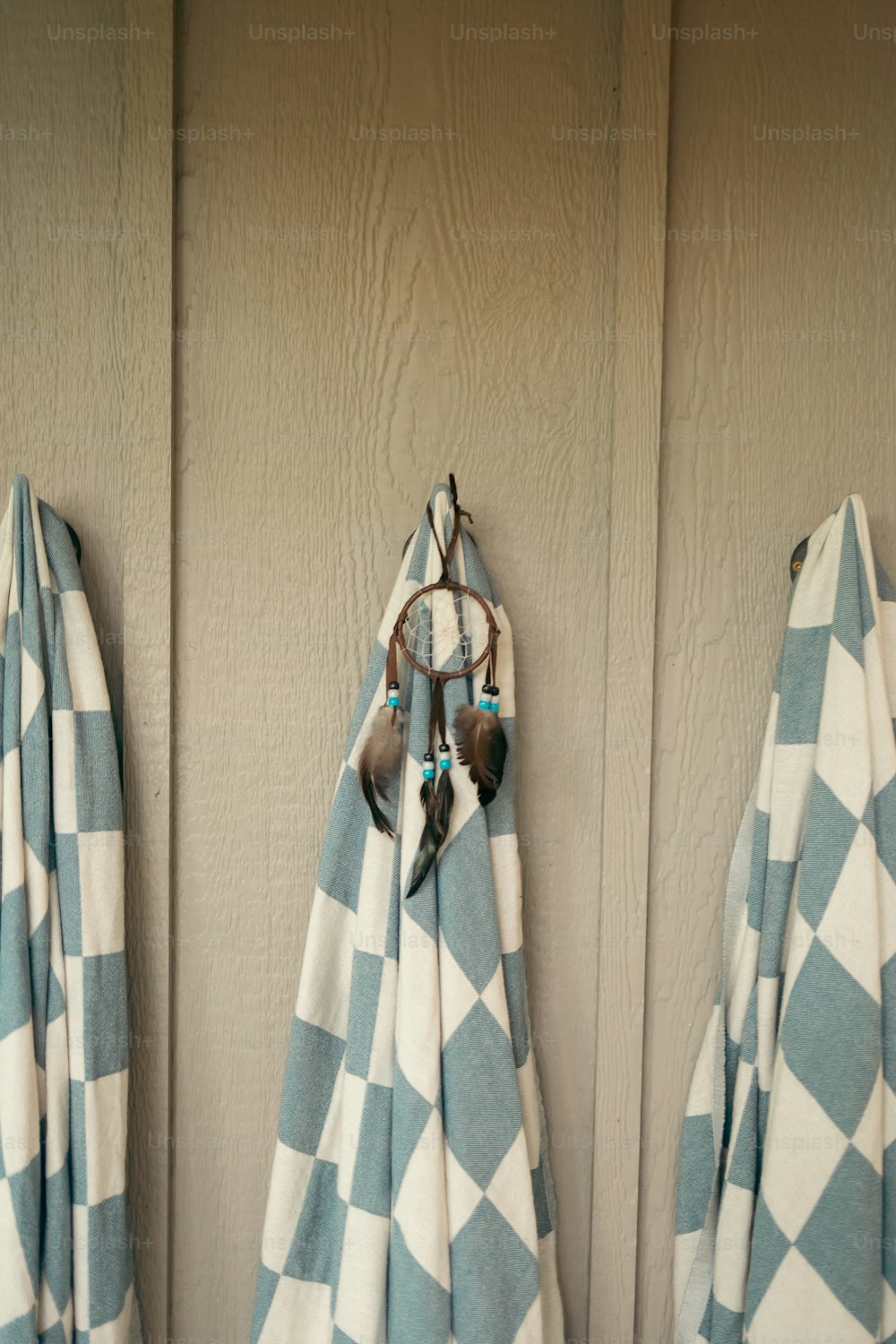 a couple of towels hanging on a wall