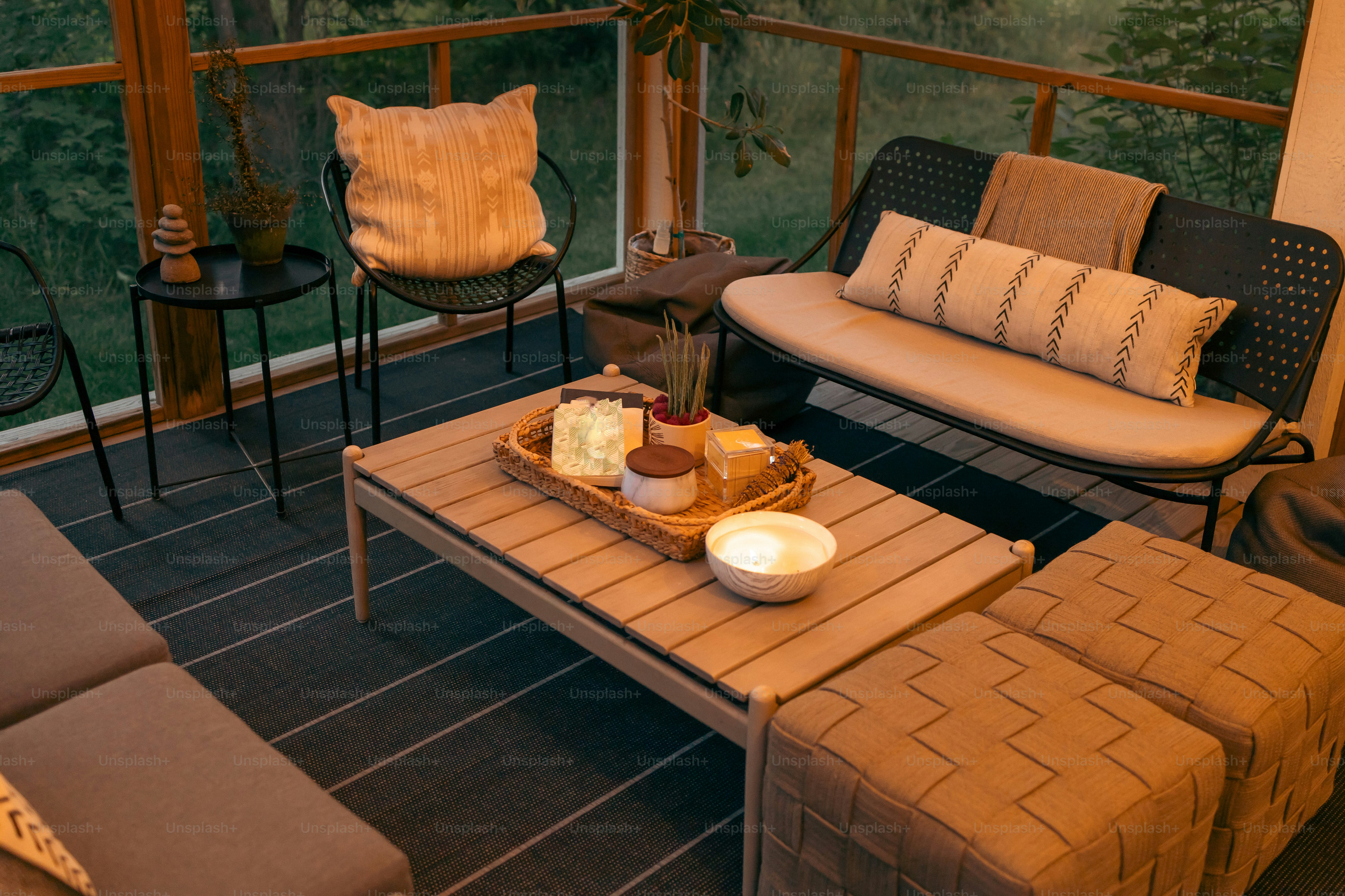 a living room filled with furniture and a tray of food