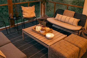 a living room filled with furniture and a tray of food