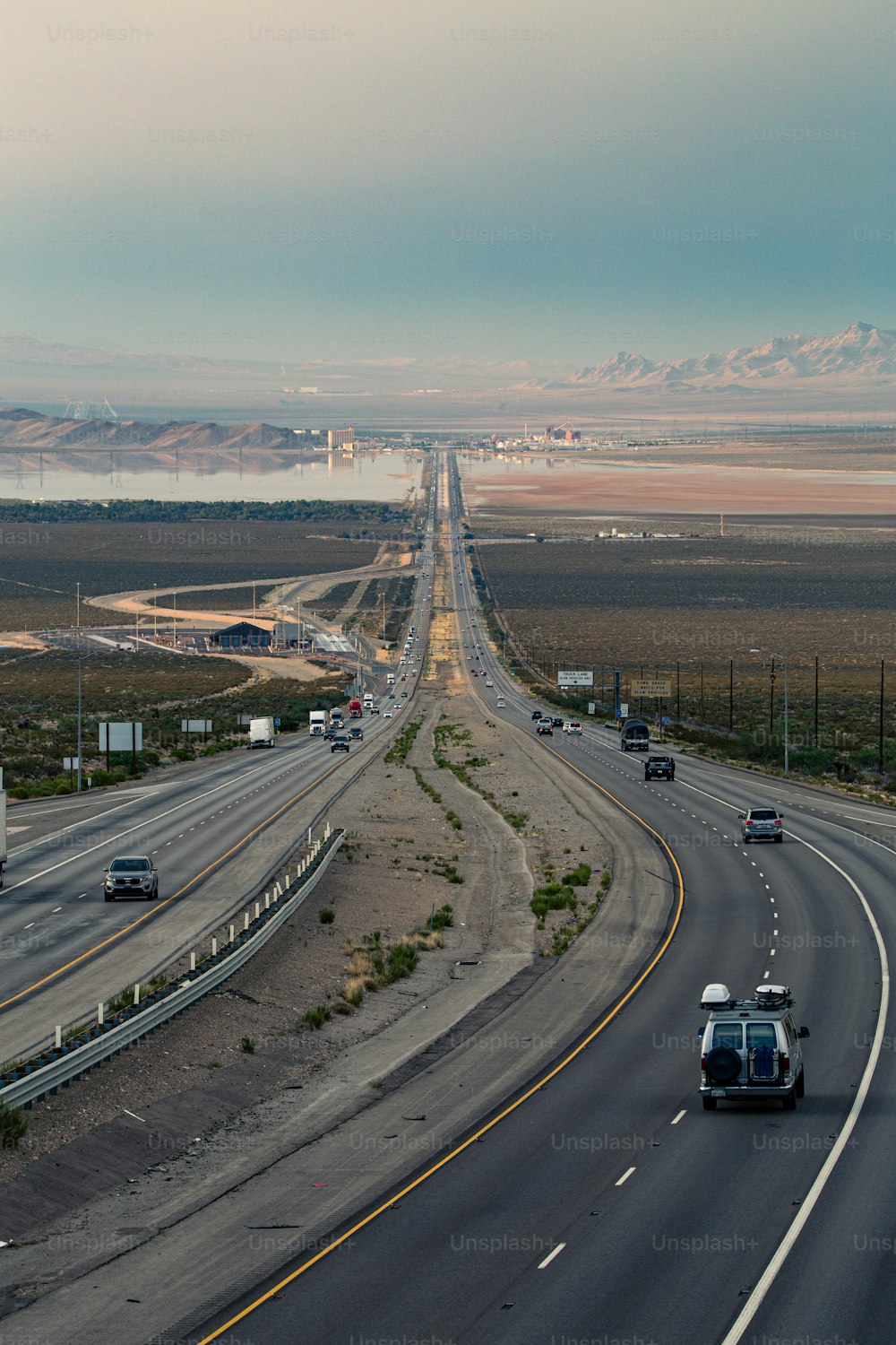 a highway with a few cars driving down it