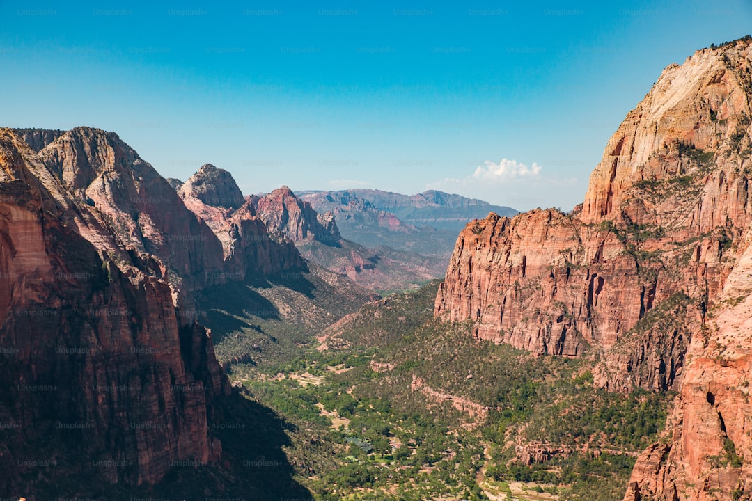 a scenic view of a valley and mountains