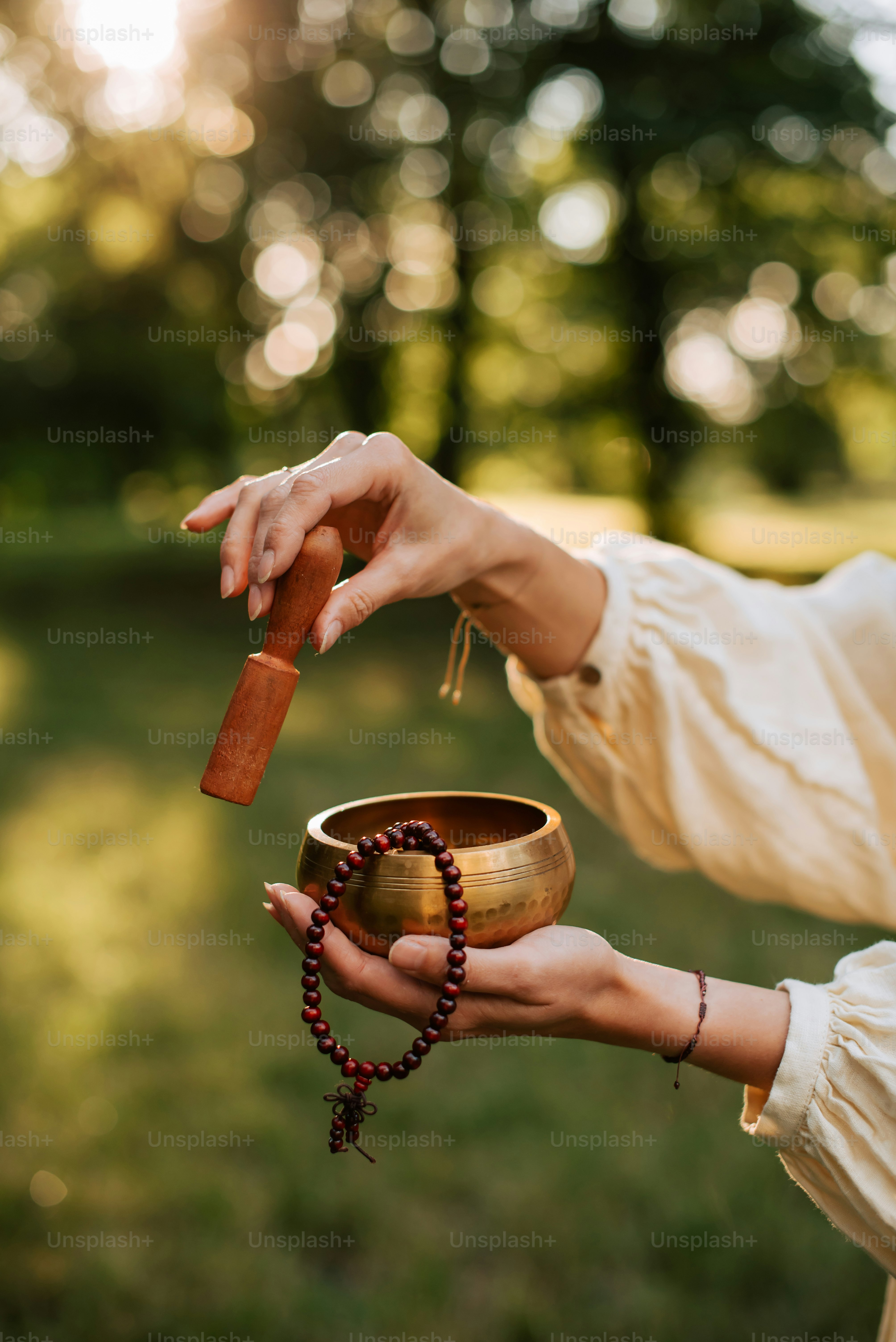 a woman holding a wooden chalice in her hand