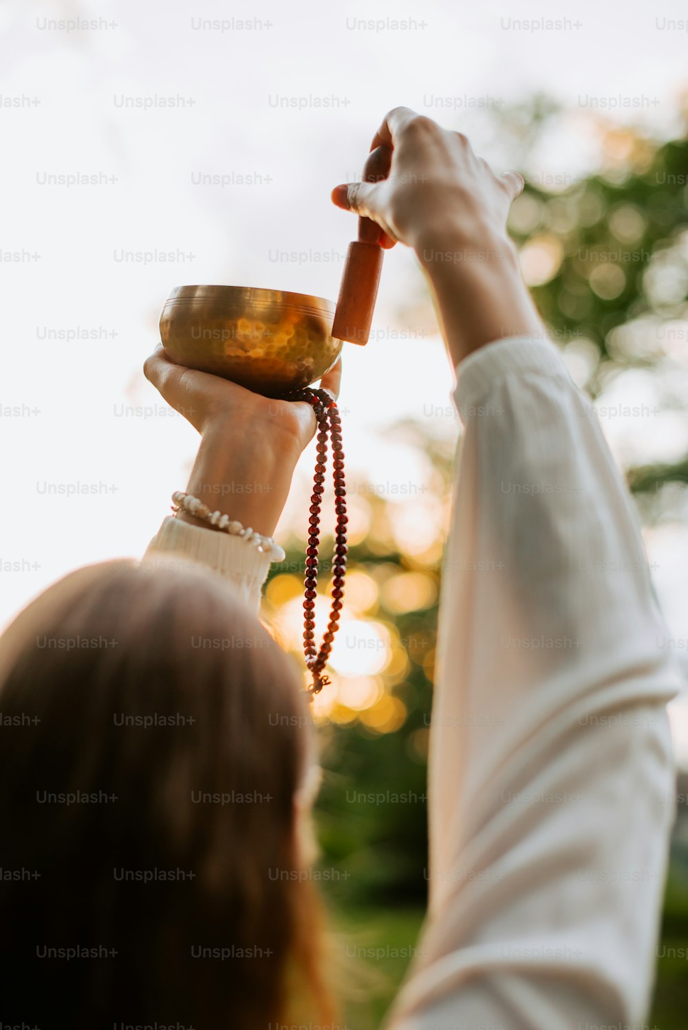 a woman holding a chalice in her hands
