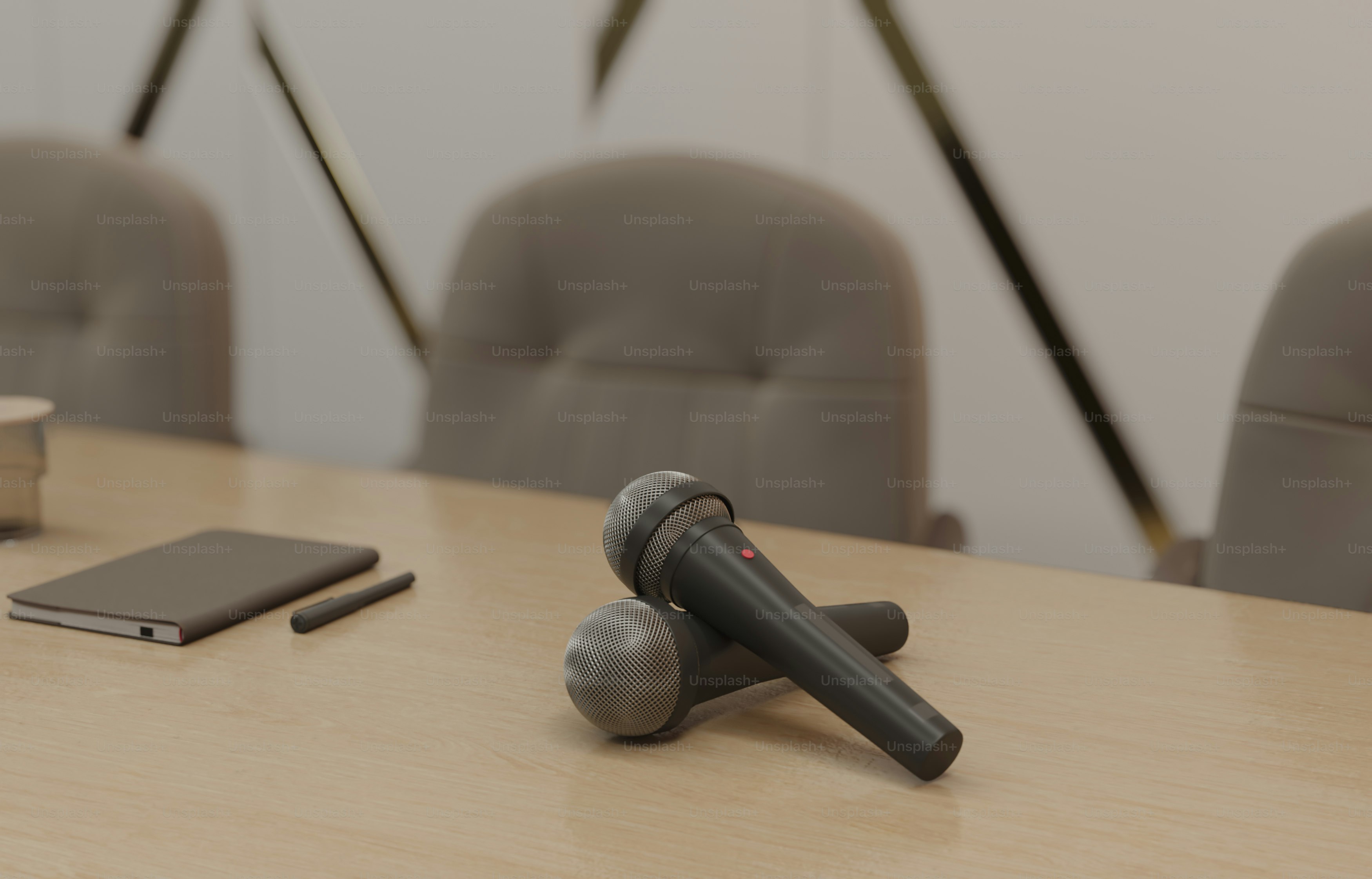 a table with a cell phone and a microphone on it