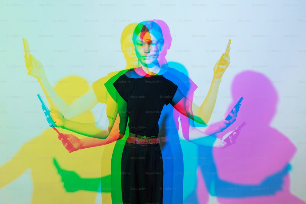 a woman is standing in front of a colorful background