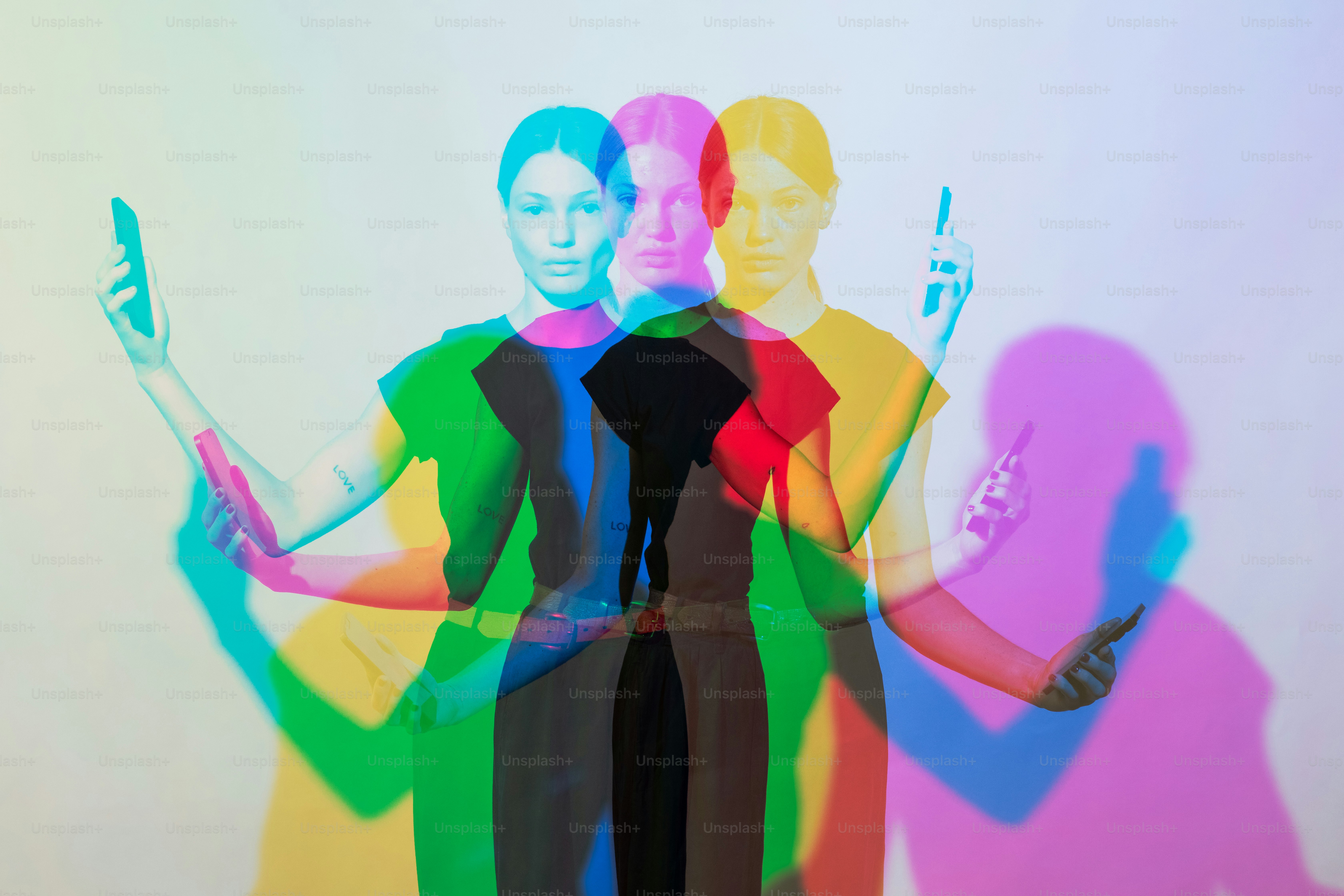 a man and a woman standing in front of a wall