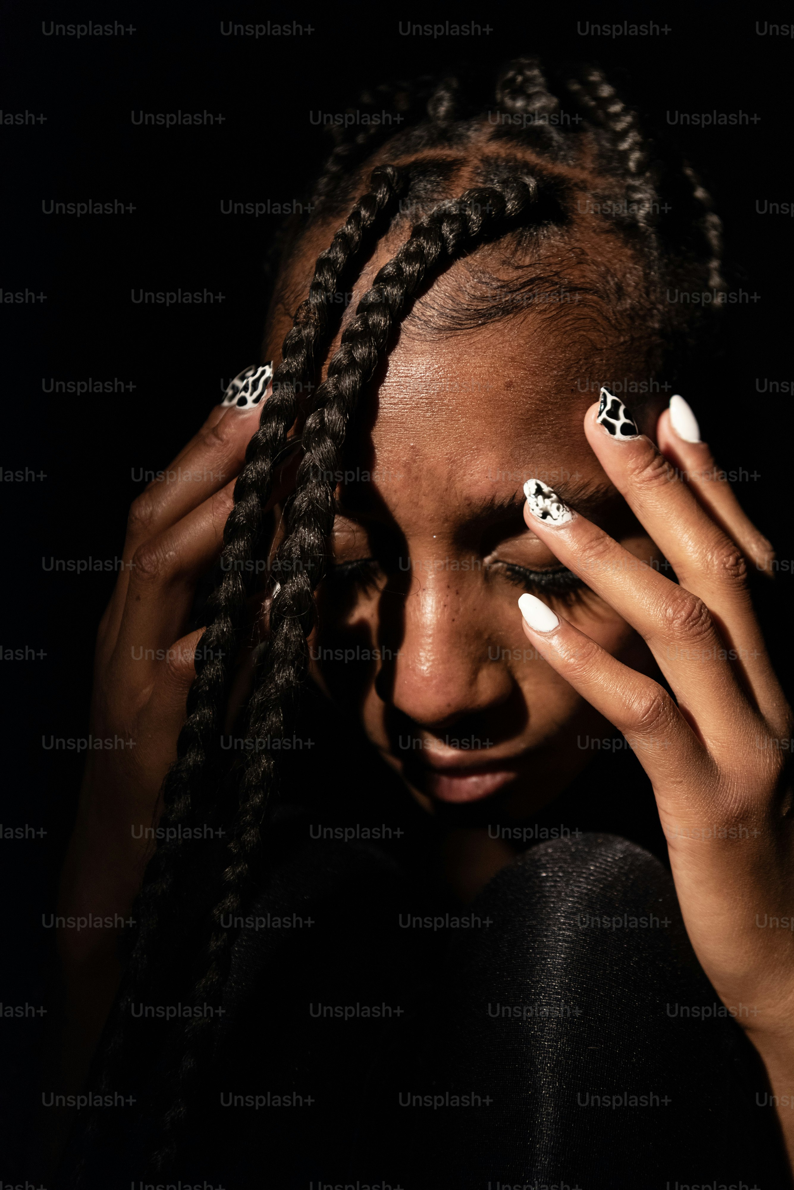 a woman with her hands on her face