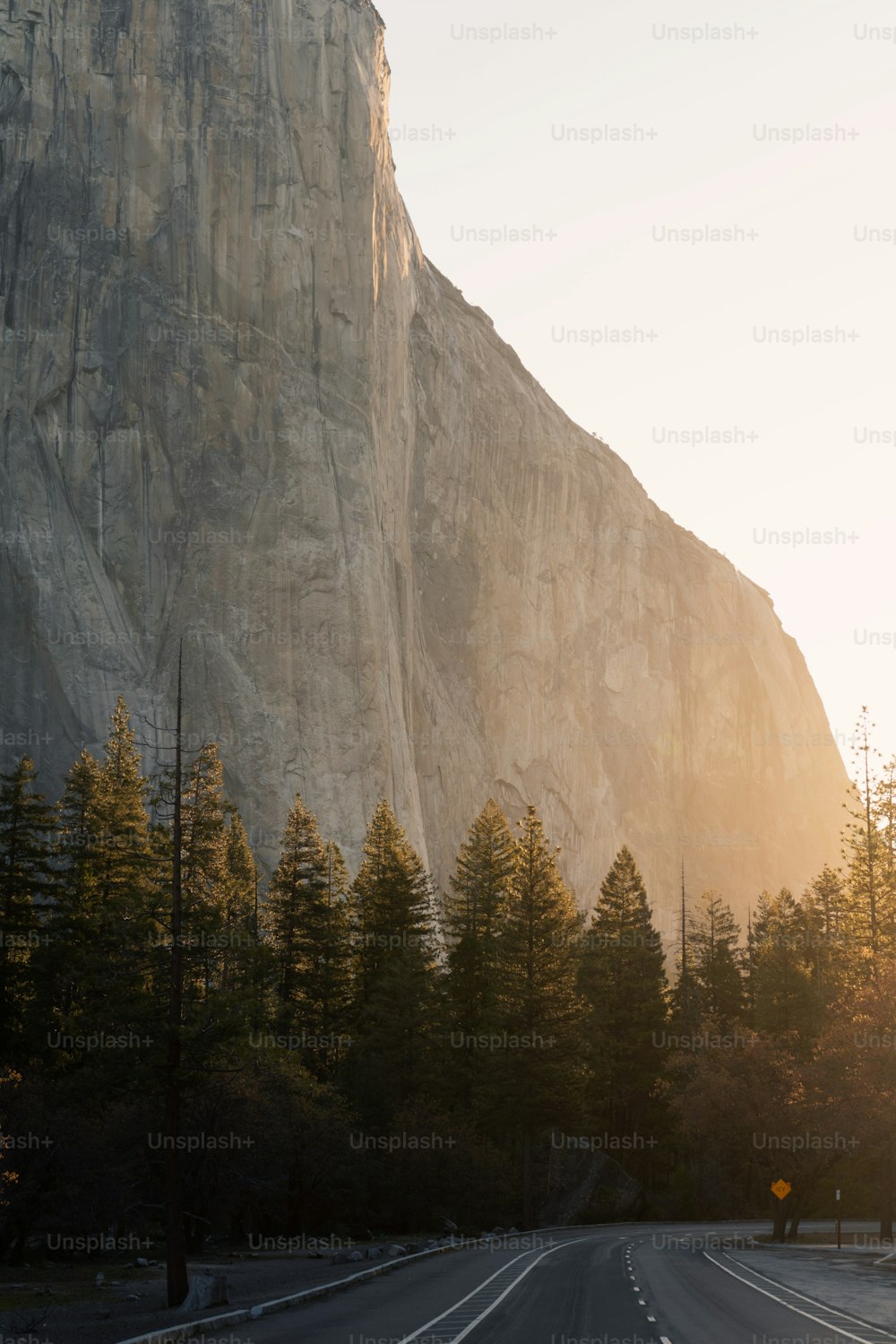 a road with a mountain in the background