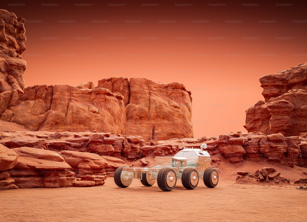 a truck is parked in the desert near some rocks