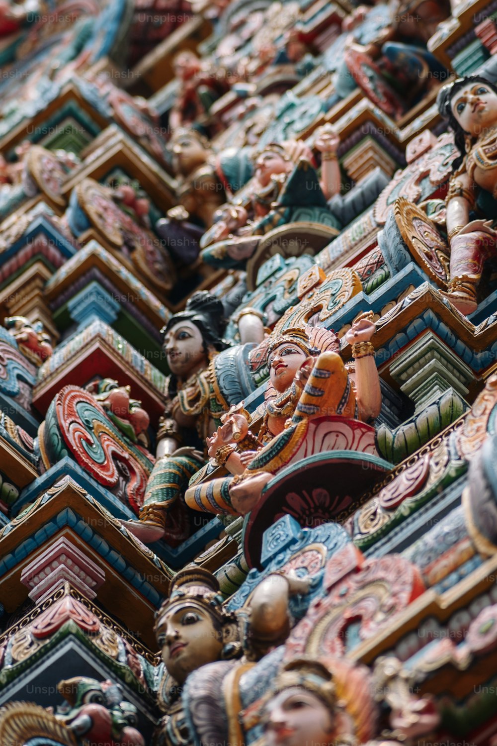 a close up of a bunch of statues on a wall
