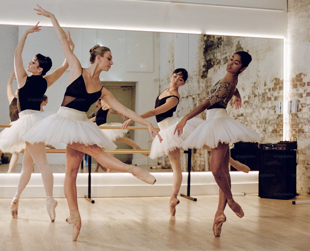 a group of ballerinas in a dance studio