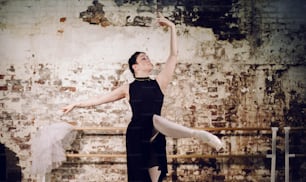 a woman in a black dress and a ballerina