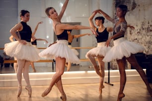 a group of ballerinas in a dance studio