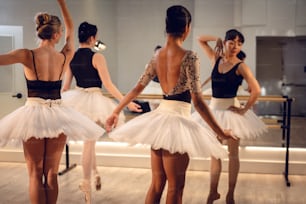 a group of young ballerinas in a dance studio