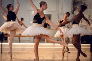 a group of ballerinas in a dance studio