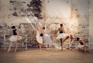 a group of ballerinas in a ballet studio