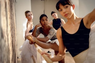 a group of young ballerinas practicing their moves