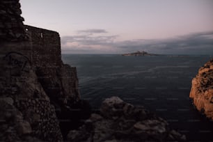 a view of a body of water with a small island in the distance