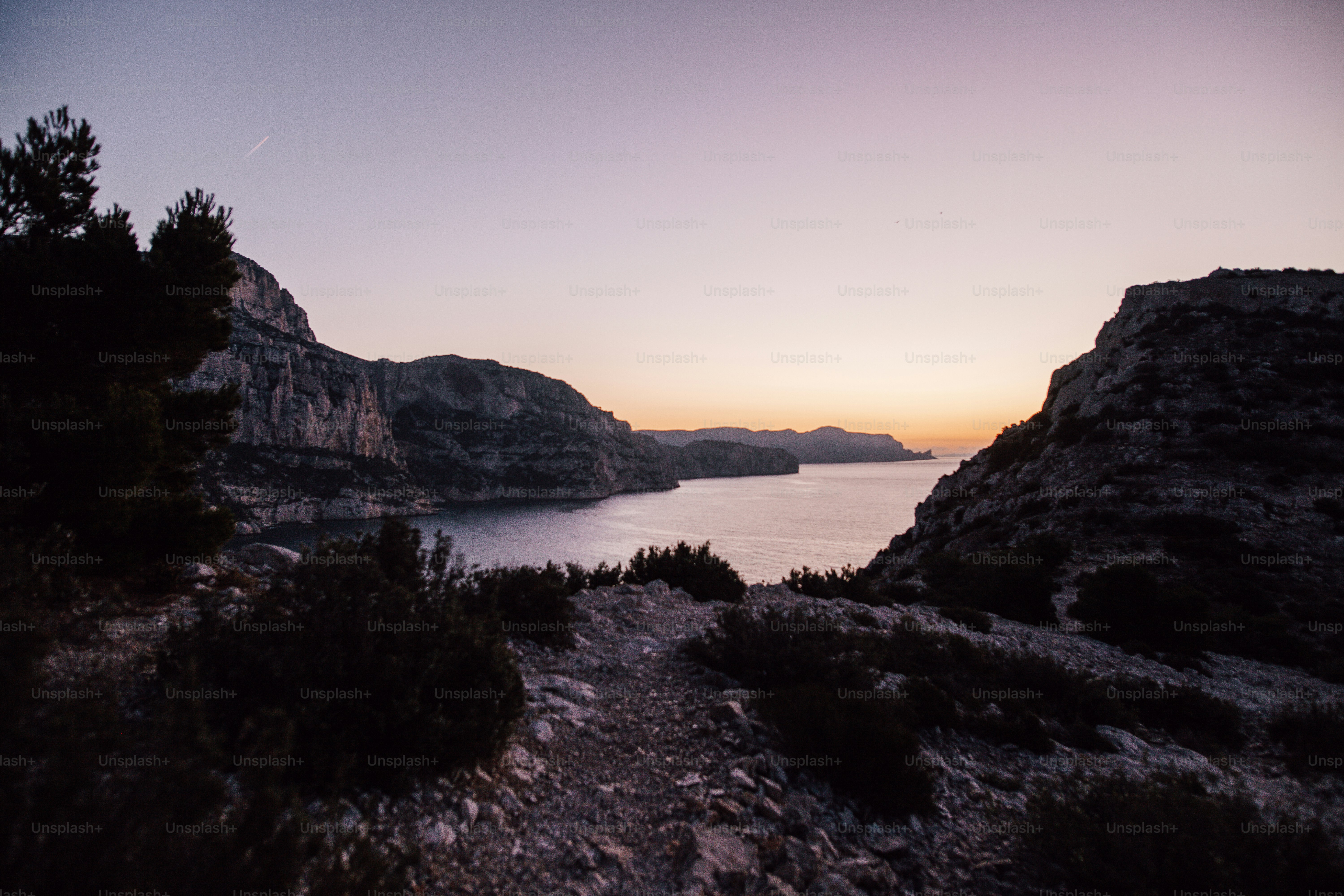 a view of a body of water at sunset