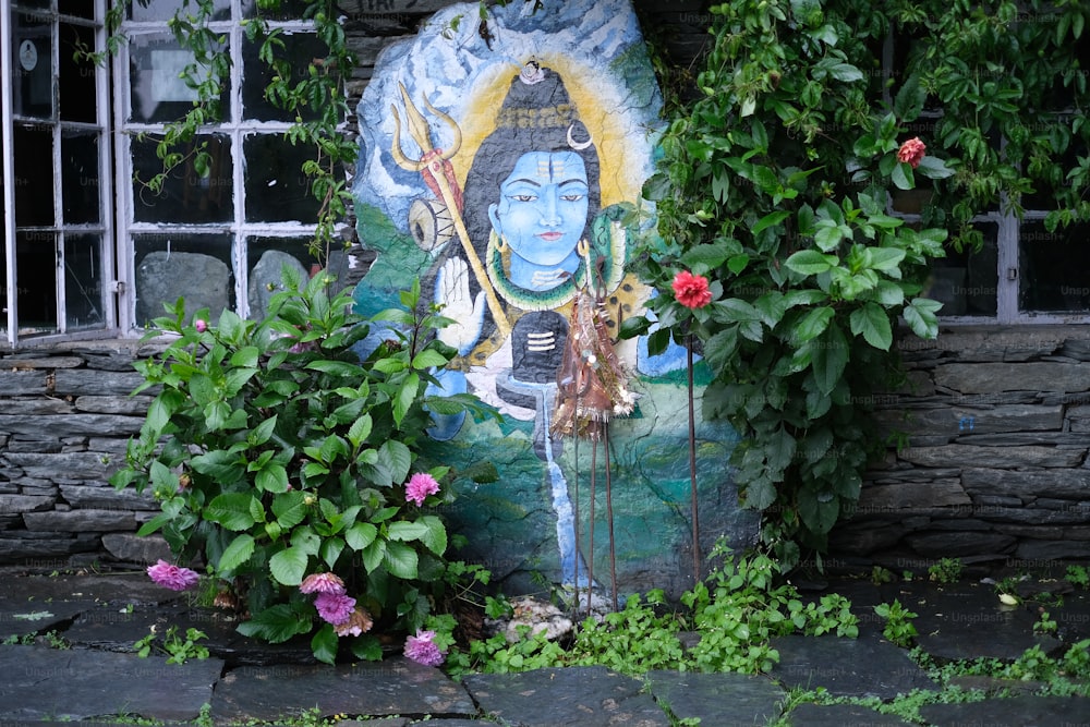 Uma pintura de um Buda cercado por plantas e flores
