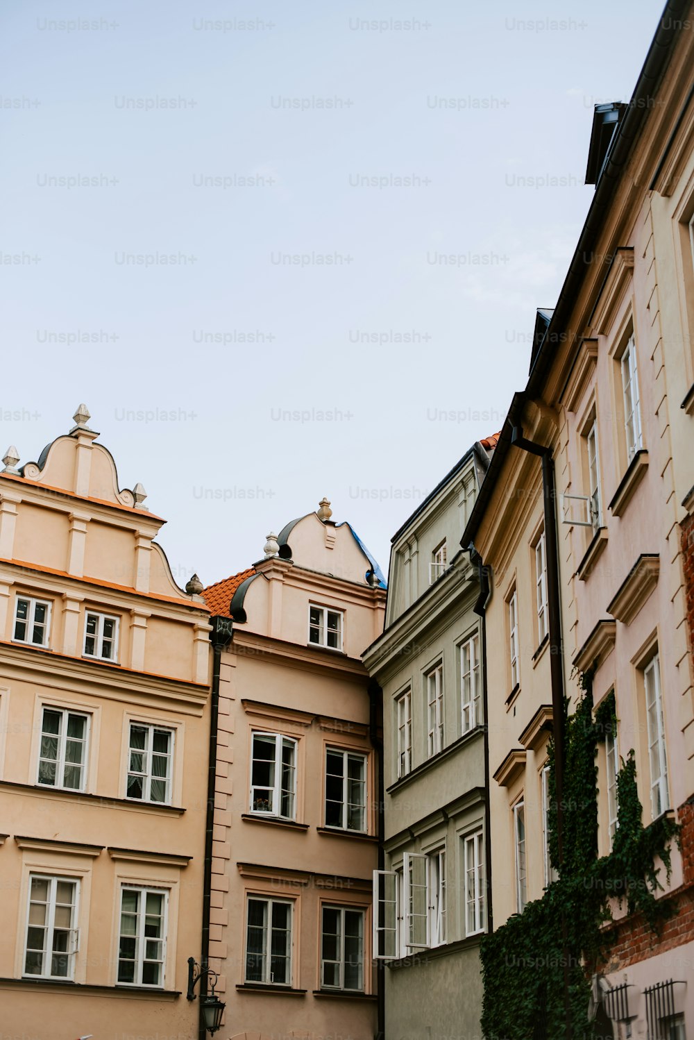 a row of buildings with a clock on the top of one of them