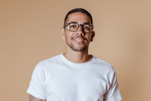 a man wearing glasses and a white shirt