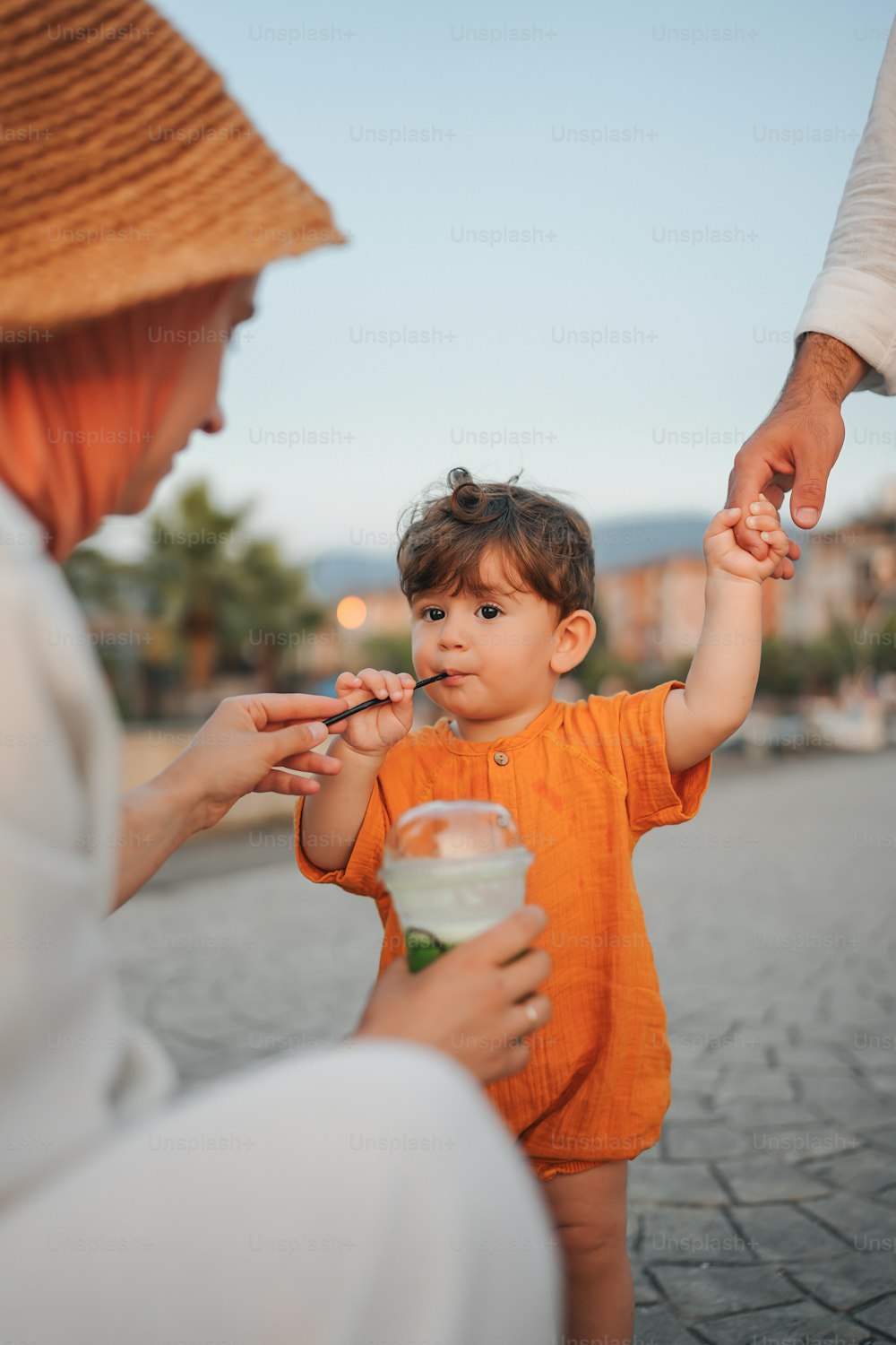 a woman feeding a child a spoon of food