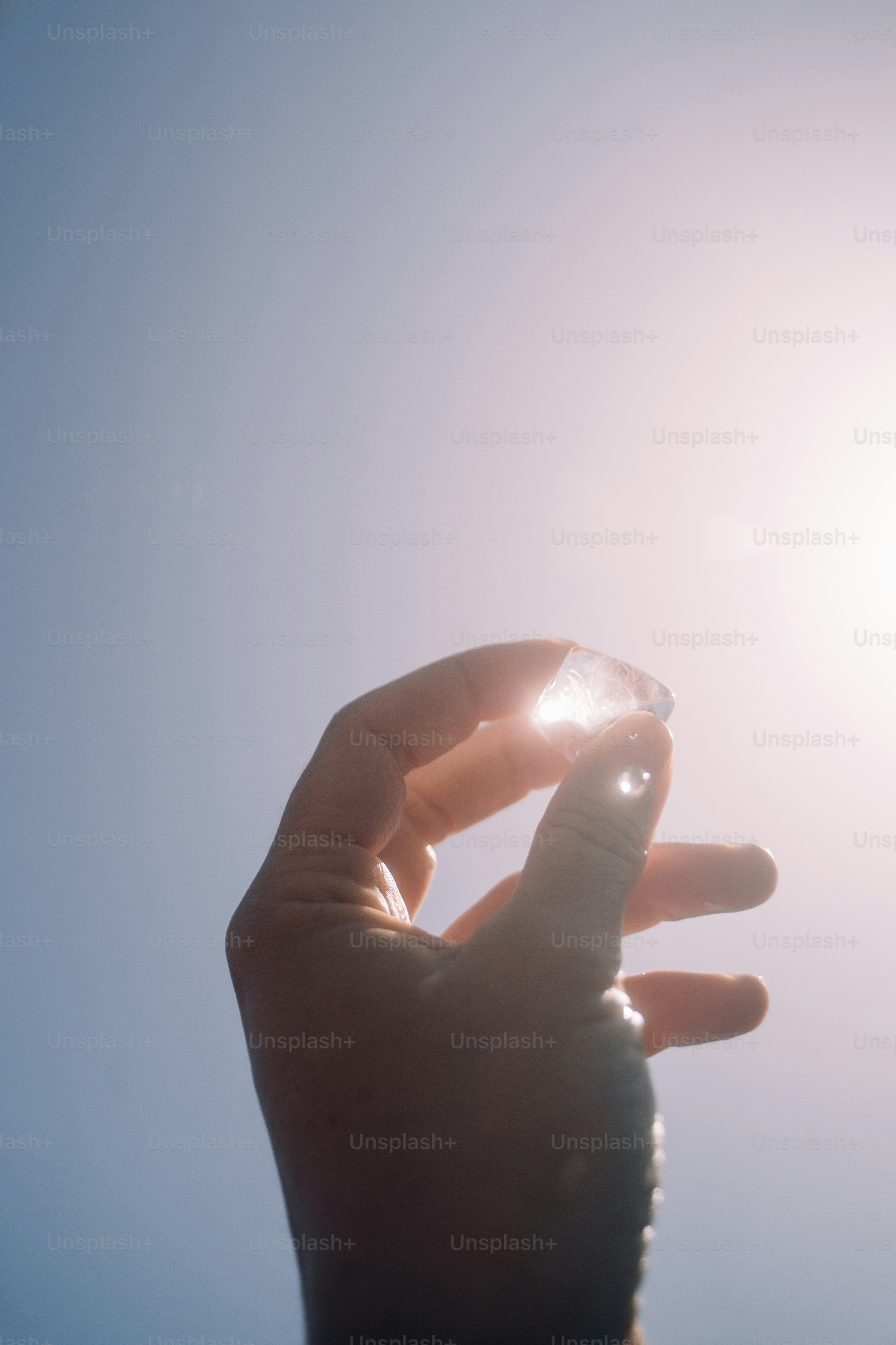 a person holding a small object in their hand