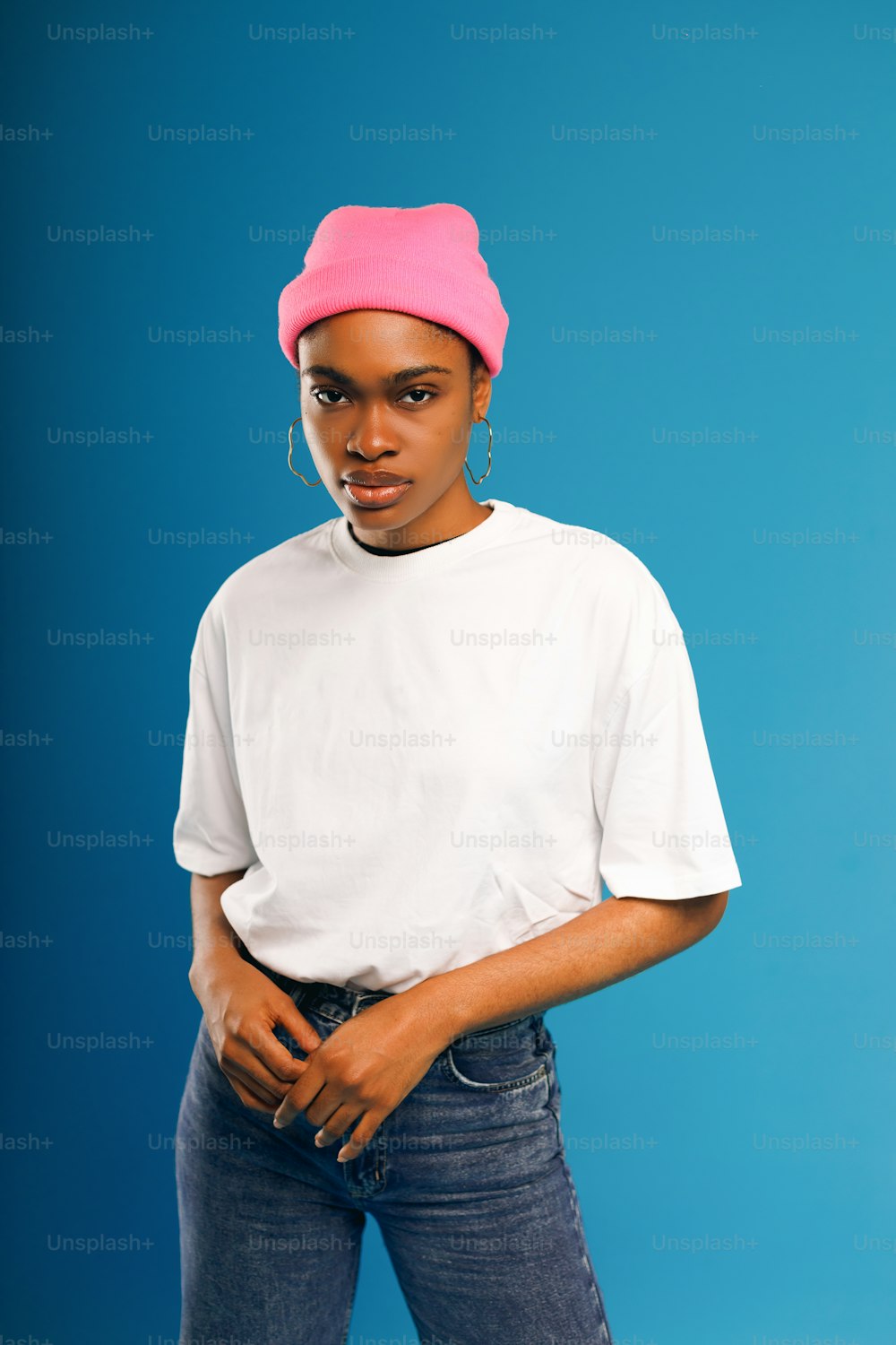 a woman with a pink hat on her head