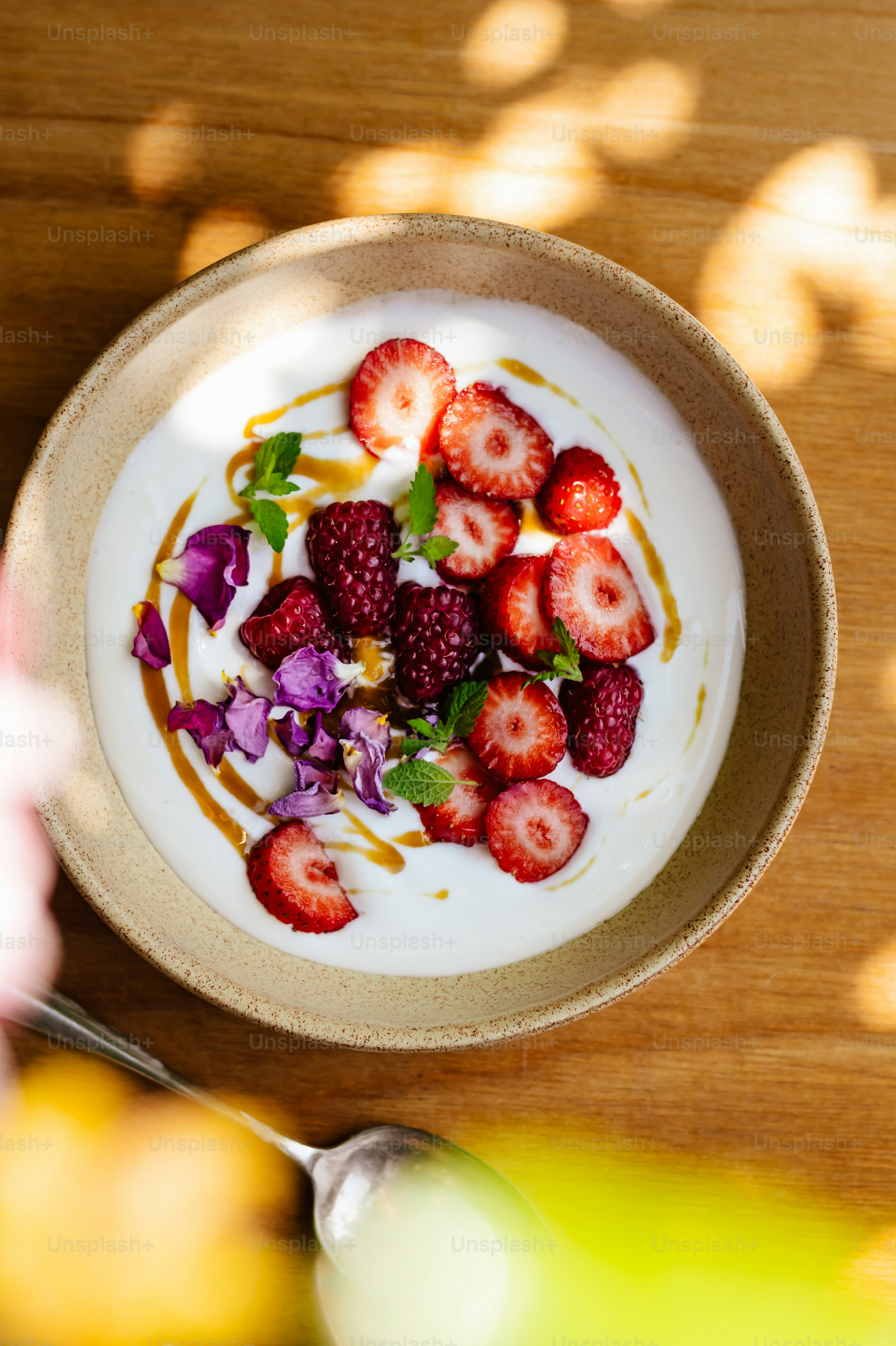 a bowl of yogurt with strawberries on top