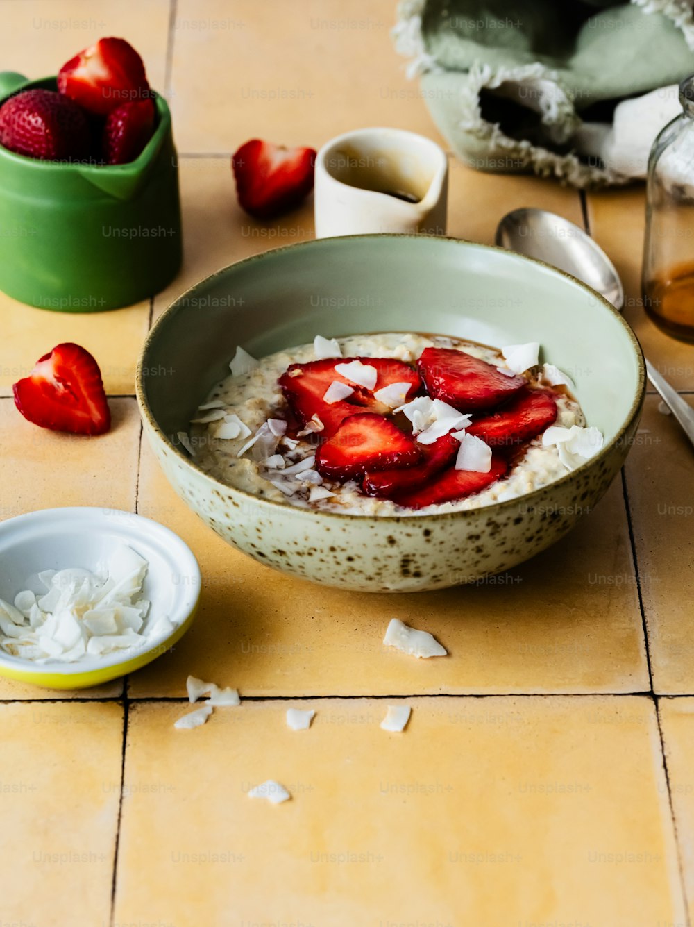 a bowl of oatmeal with strawberries on top