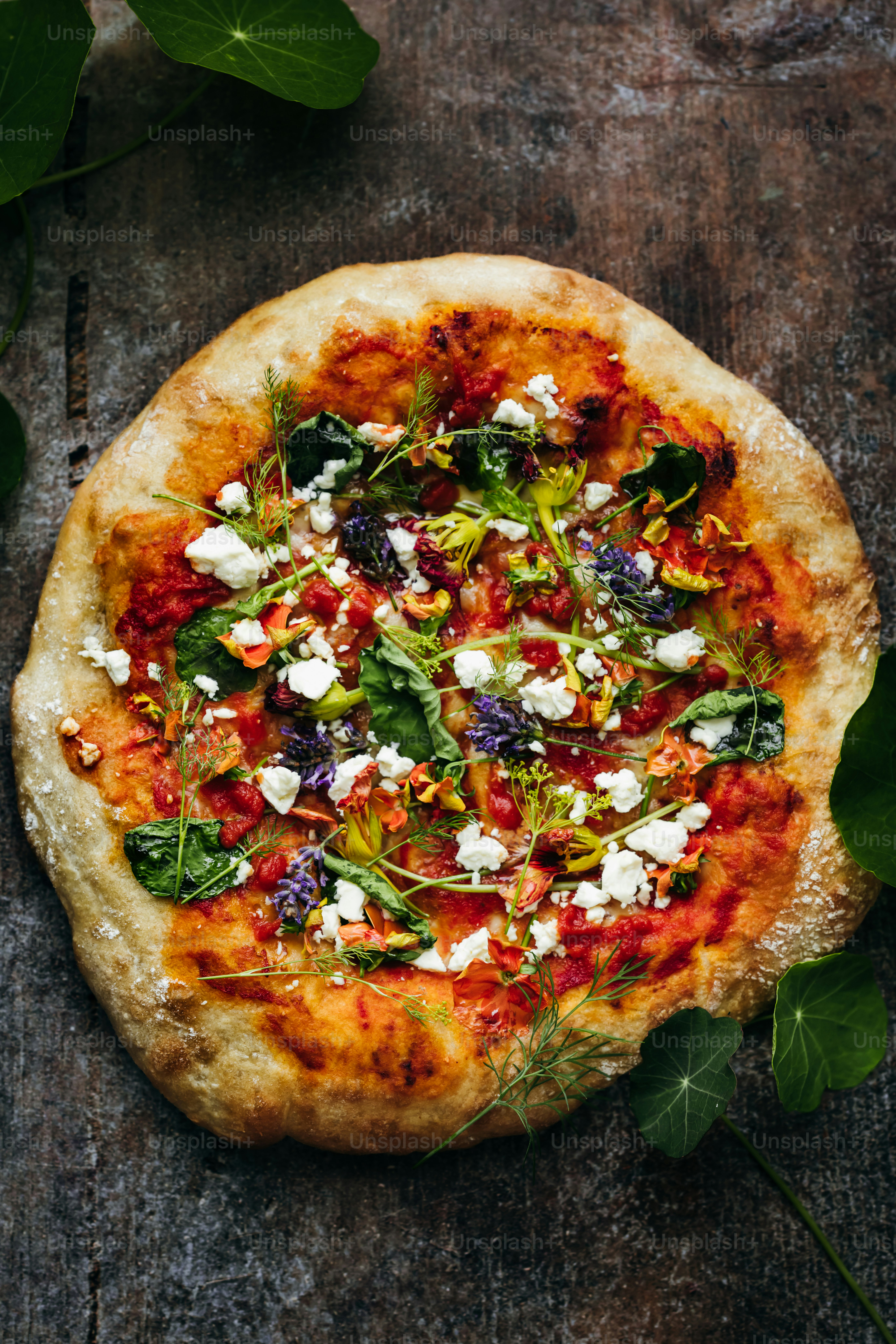 a pizza topped with lots of veggies and cheese