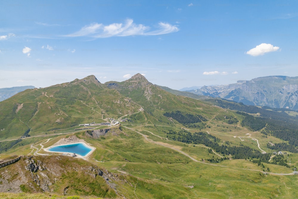 a view of a mountain with a lake in the middle of it